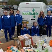 Junior members of Chesterfield FC Women with some of the things they have donated to Chesterfield Foodbank. Pictures submitted.