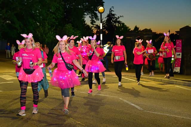 Several participants added additional sparkle to the walk with lights in their tutus and around their necks.