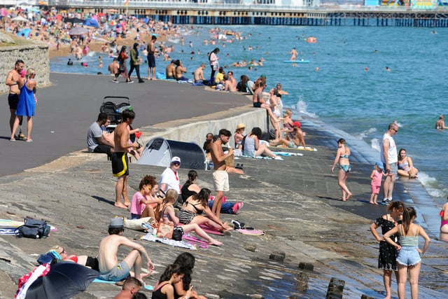 People flocked to the seafront in Southsea on the hottest day of the year. Picture: Sarah Standing (250620-5003)