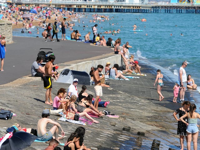 People flocked to the seafront in Southsea on the hottest day of the year. Picture: Sarah Standing (250620-5003)