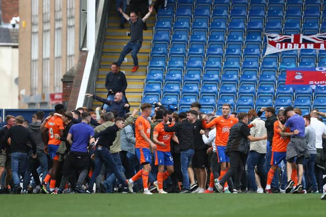 Oldham Athletic fans invaded the pitch at the SMH Group Stadium. Picture: Tina Jenner