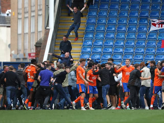 Oldham Athletic fans invaded the pitch at the SMH Group Stadium. Picture: Tina Jenner