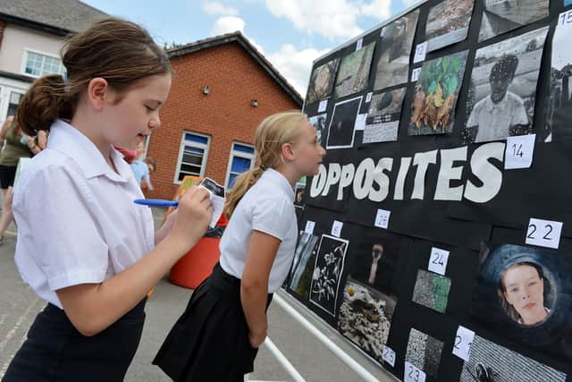 Children at Spire Junior School casting their votes for the Year 6 photo gallery
