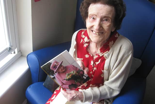 Joan Bullock with her card from the Queen at Ashgate House Care Home.
