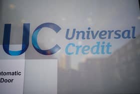 A Universal Credit sign on a door of a job centre. Universal Credit is a monthly payment available to those on low incomes and those out of work.