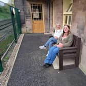 Debbie Hutchinson, left, and Jennie Dunn, on the bench which bears their father's name at Wingfield station. (Photo: Derbyshire Historic Buildings Trust)
