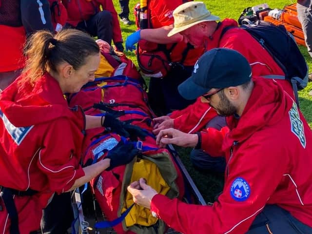 Buxton Mountain Rescue Team dealing with a walker who fell broke their jaw, perforated their ear drum and lost teeth. Pic BMRT.