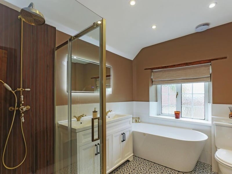 The stunning bathroom, with free-standing bath and walk-in shower.