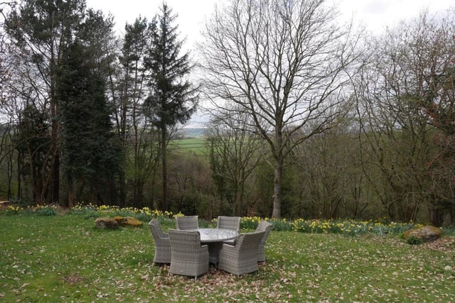 Stunning views of the countryside beyond the woodland contained within the two-acre plot.