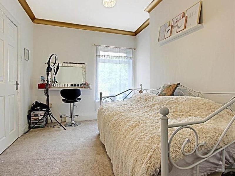 Another view of the second bedroom. It shows how bright and appealing the space is.