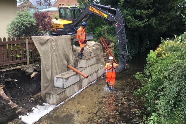 The Environment Agency has begun work to repair a wall on Bentley Brook which collapsed during the flood. (Photo: Moyra Wilson)
