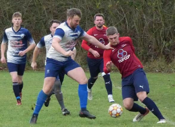 Action from Britannia Tupton's game with Crown Killamarsh (in red) in HKL TWO. Photos by Martin Roberts.