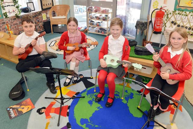 A music lesson at Heath Primary where pupils are learning to play the Ukulele