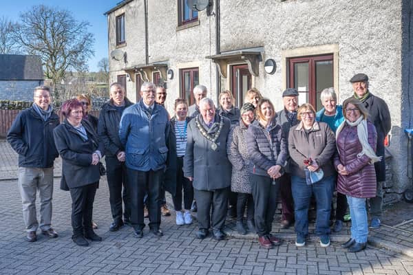 District councillors, officers, NCHA officers and Palfreyman Trust members outside the Soldiers Croft homes. (Photo: Derbyshire Dales District Council)