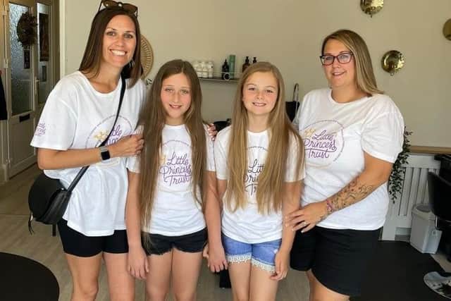 From left, Emma Pride, Hattie Pride, Tia Baker and Emma Baker before the haircut.