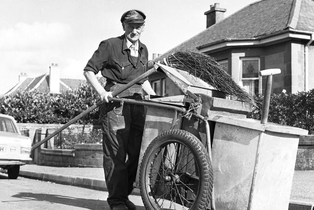 Edinburgh Corporation street cleaner with his cart and besom broom in Ferniehill Road Edinburgh in October 1970.