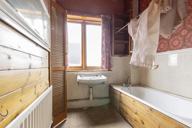 The bathroom has a bath, basin and airing cupboard housing the hot water cylinder. There is a separate wc.