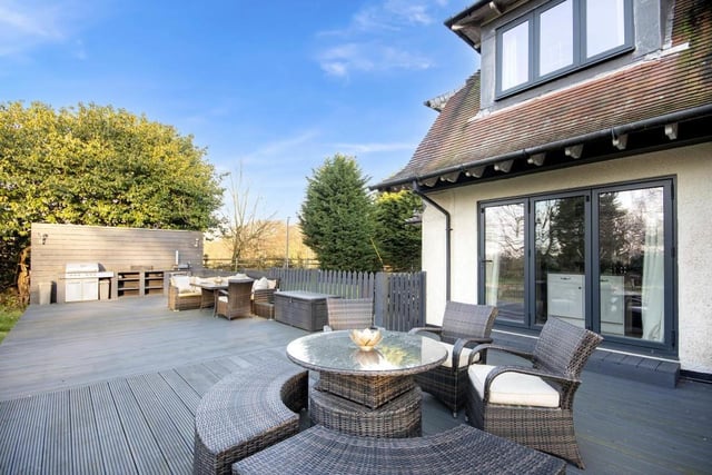 This decked seating area is a lovely spot in which to relax or entertain family and friends.