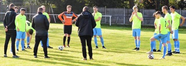 Bakewell Town boss Ross Davies guides his players through a training session.