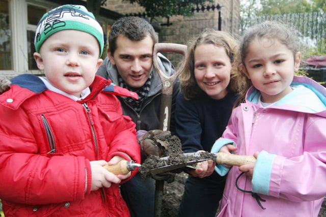 Highfield Hall nursery pupils Callum Robertson and Frankie Salt get digging with Post office worker Danny Hutchinson and Sheena Le Bas from Derbyshire Wildlife trust in 2008