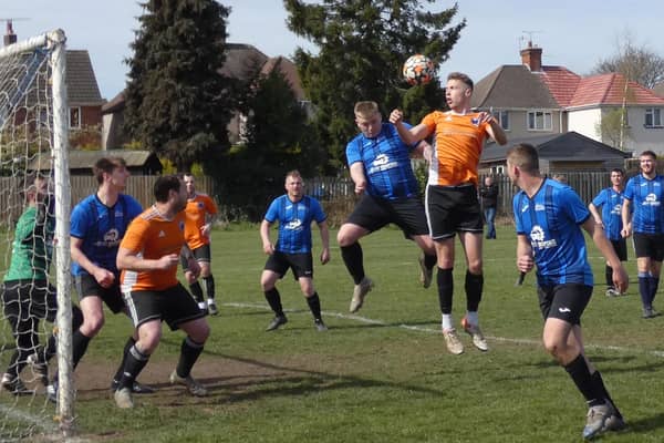 Action from Boot & Shoe (blue) against Mutton. Photo by Martin Roberts.