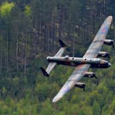 A Lancaster bomber will perform a flypast over Hardwick Hall this weekend to mark the anniversary of the historic Dambusters raids during World War Two (pic: Andrew Yates/AFP/Getty Images)
