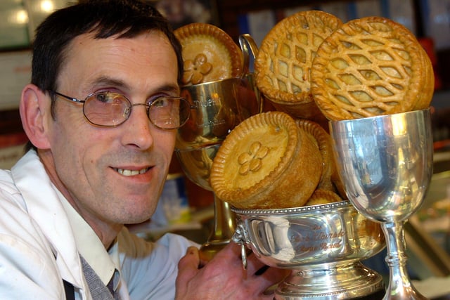 Butcher Michael Cocking. with his pies and prizes in 2005