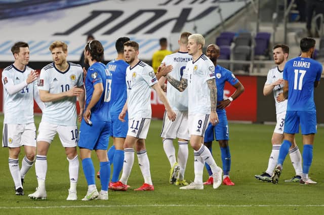 Scotland and Israel players share disappointment at the end of the 1-1 draw in Tel Aviv. (Photo by JACK GUEZ/AFP via Getty Images)