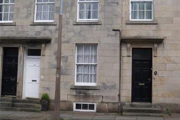 This four-bedroom terrace home is available for £950 per calendar month with OpenRent.