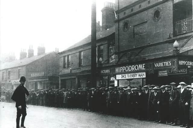 Crowds queuing outside Ripley Hippodrome for a miners' strike concert.