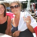 Outdoor drinkers at the Spotted Frog, in Brampton, watch England's 2-0 Euro 2020 win over Germany in June last year. Pictured are Laura and Mel Cliff.