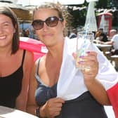 Outdoor drinkers at the Spotted Frog, in Brampton, watch England's 2-0 Euro 2020 win over Germany in June last year. Pictured are Laura and Mel Cliff.
