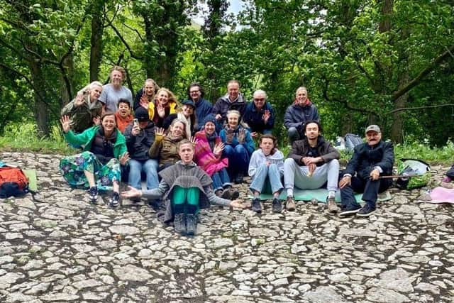 Rachel Elnaugh, front row, third from left, with some of her group's members after they had cleared a limestone reservoir on the land.