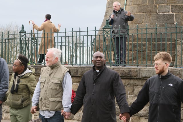 The Archbishop of Canterbury and Bishop of Derby lead prayers from Crich Stand whilst theose thetre form a ring around the memorial