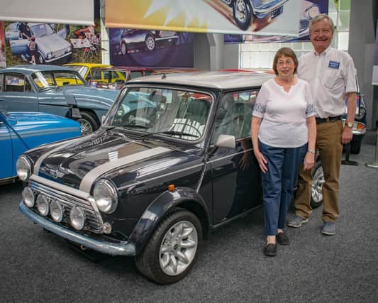 Jennifer Harris with Richard Harris, chief executive officer of the Great British Car Journey, and Alec the Mini.