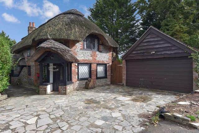 This thatched home in Anmore Lane, Denmead is on sale for £850,000.