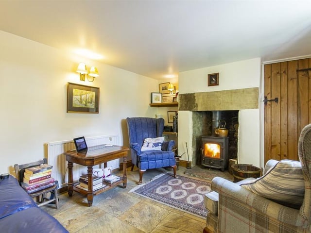 The snug is warmed by a multi-fuel stove housed in a stone hearth and there is electric underfloor heating.