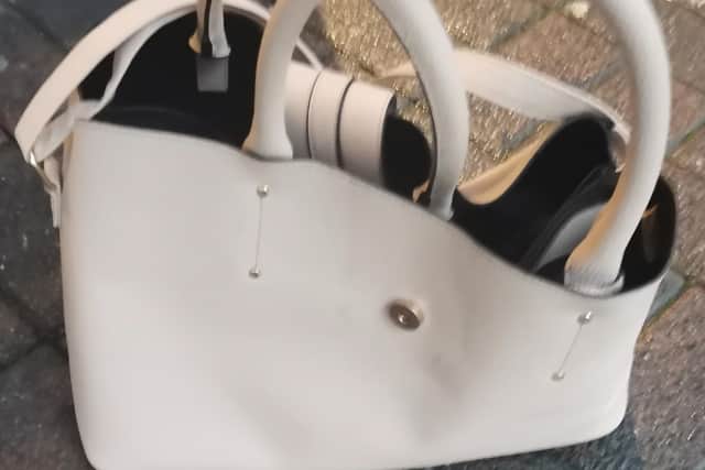 The handbag was found dumped in the men's toilets at Meadowhall Interchange.