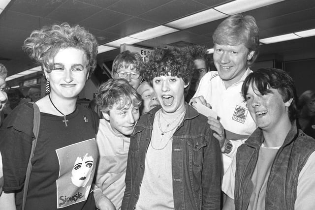 Radio 1 DJ David Jensen was pictured at Boots in Sunderland Market Square in August 1983 as he signed an autograph using the back of Wendy Goldsmith (14) of Ford Estate.