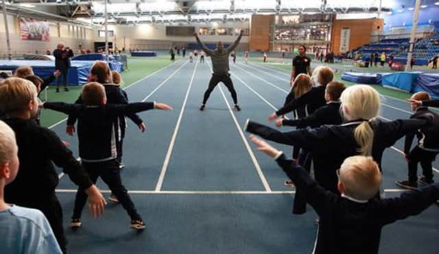Dwain Chambers puts the kids through their paces.