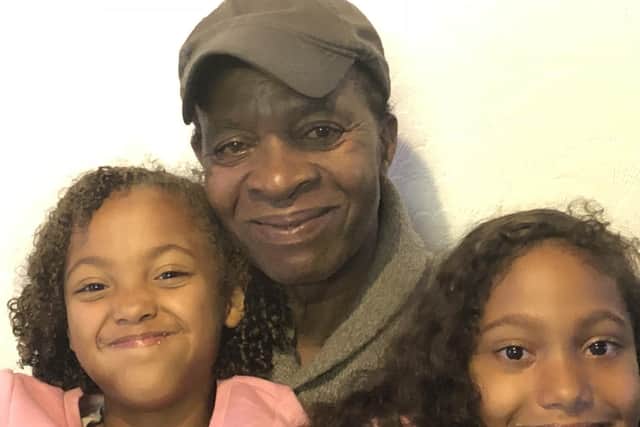 Uriah, known to many as Sandy, doted on his family. Pictured with two of his granddaughters.