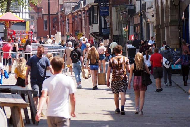Shoppers enjoy the warm weather in Chesterfield town centre.