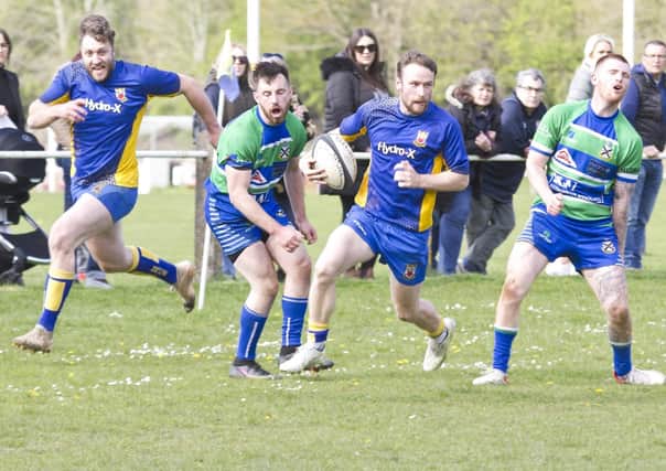 Henri Packard is pictured on the run as he scores a try against Ilkeston. Photo by Colin Baker.