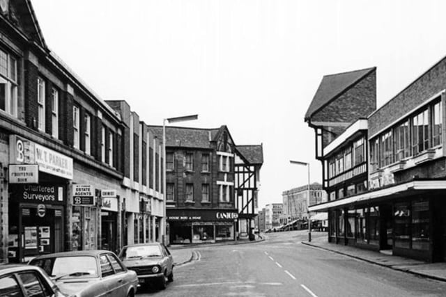 This image from 1983 shows some of the old shops on Vicar Lane, looking towards the market hall
