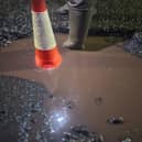 A traffic cone placed in one of Dronfield's worst potholes to illustrate its depth. (Photo: Contributed)