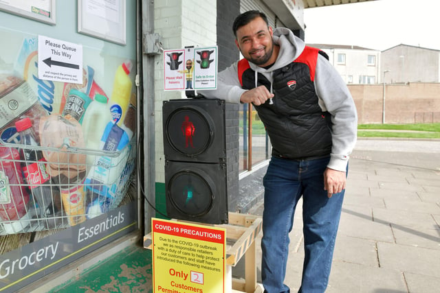 Day-Today Express Hallglen Shopping Centre operating a traffic light system to give shoppers access to the store