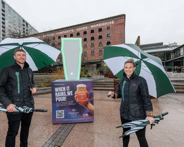 Launch of Greene King Pubs'  ‘It Rains, We Pour’ campaign, Manchester with 9ft tall pint glass detector.