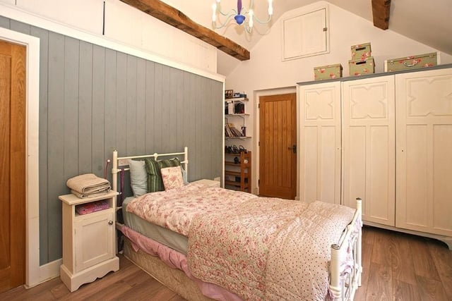 There are exposed roof timbers in two of the bedrooms which also have en-suites.