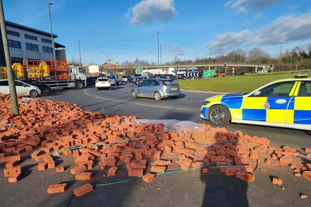 Derbyshire Roads Policing Unit is at the scene on Horns Bridge Roundabout this afternoon where a lorry has shed part of its load of bricks (picture: Derbyshire RPU)
