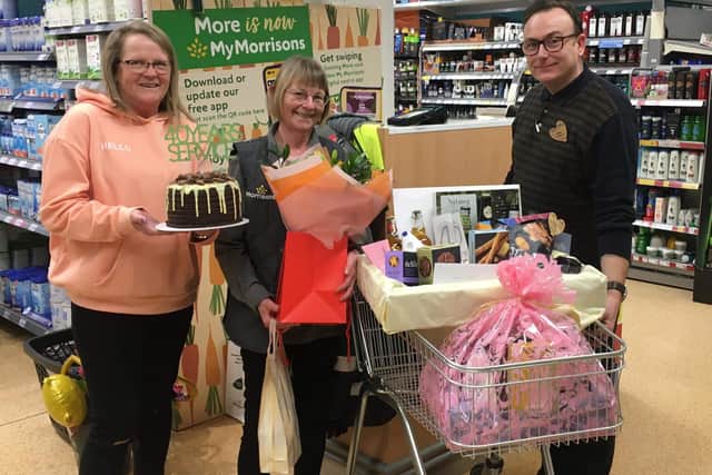 Helen Ruck, pictured centre with Sandra Moakes and store manager Luke Foster,  is celebrating 40 years service with Morrisons in Staveley